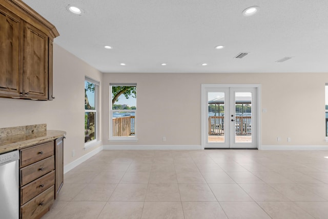 411-A Cobia Ave, Fort Walton Beach, FL 32548 - unfurnished dining area with healthy amount of natural light, recessed lighting, french doors, and light tile patterned flooring