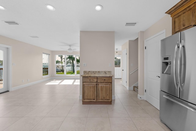 411-A Cobia Ave, Fort Walton Beach, FL 32548 - kitchen with stainless steel fridge with ice dispenser, ceiling fan, brown cabinetry, light tile patterned flooring, and recessed lighting