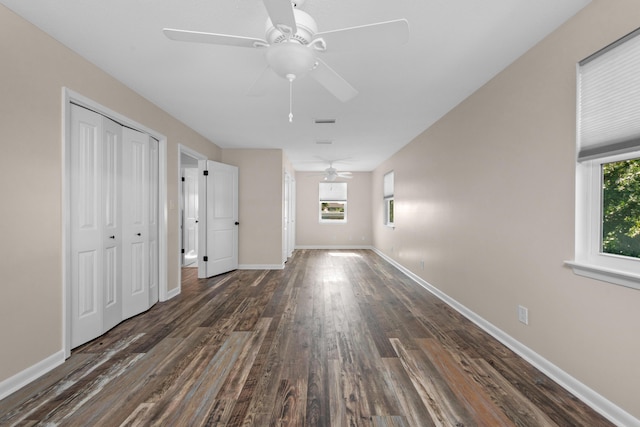 411-A Cobia Ave, Fort Walton Beach, FL 32548 - unfurnished bedroom featuring dark wood finished floors, a closet, and a ceiling fan