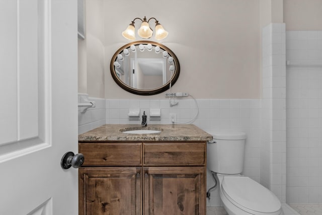 411-A Cobia Ave, Fort Walton Beach, FL 32548 - bathroom featuring vanity, tile walls, and wainscoting