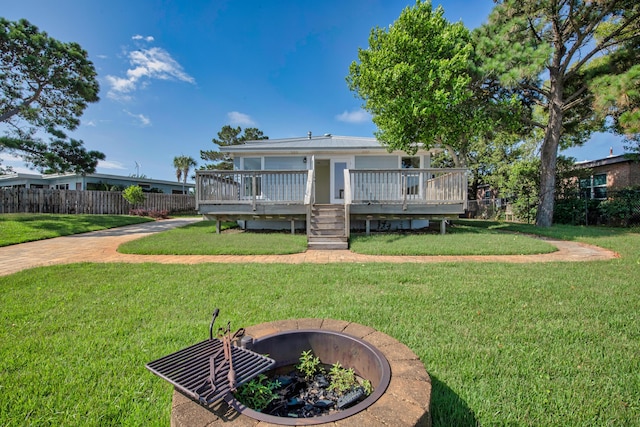 411-A Cobia Ave, Fort Walton Beach, FL 32548 - rear view of property with a deck and a fire pit