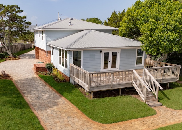 411-A Cobia Ave, Fort Walton Beach, FL 32548 - back of property featuring a deck, french doors, and a metal roof