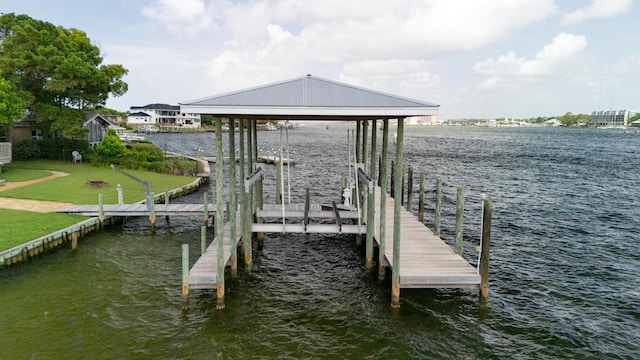 411-A Cobia Ave, Fort Walton Beach, FL 32548 - dock featuring boat lift, a water view, and a lawn