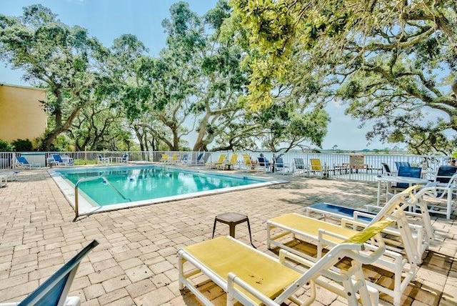 209 W Miracle Strip Pkwy Unit H 103, Mary Esther, FL 32569 - community pool featuring a patio