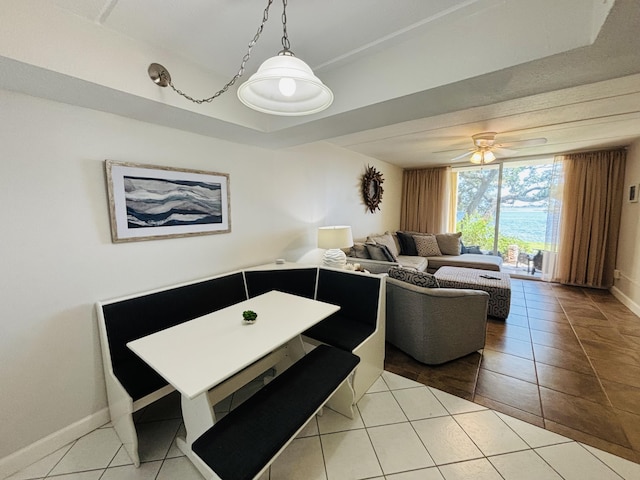 209 W Miracle Strip Pkwy Unit H 103, Mary Esther, FL 32569 - dining area featuring tile patterned flooring, baseboards, and ceiling fan