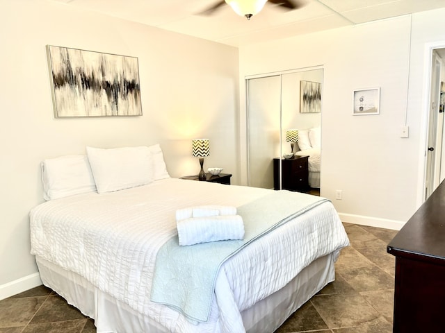 209 W Miracle Strip Pkwy Unit H 103, Mary Esther, FL 32569 - bedroom featuring a closet, baseboards, and dark tile patterned flooring