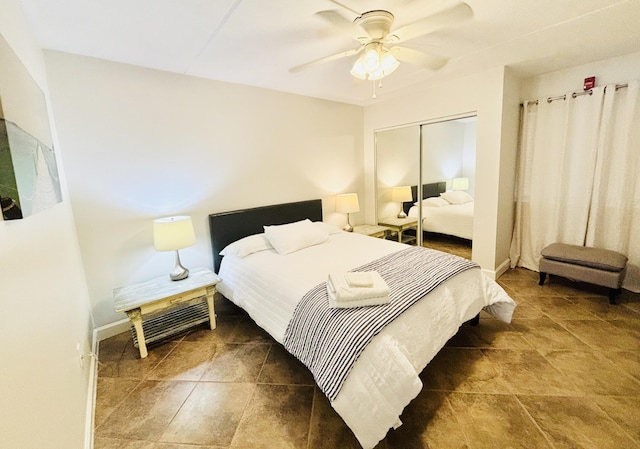 209 W Miracle Strip Pkwy Unit H 103, Mary Esther, FL 32569 - bedroom featuring a closet, ceiling fan, and baseboards