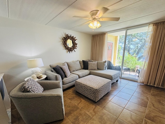209 W Miracle Strip Pkwy Unit H 103, Mary Esther, FL 32569 - living area featuring a ceiling fan and a wall of windows