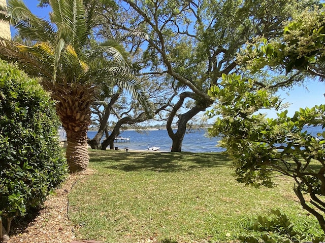 209 W Miracle Strip Pkwy Unit H 103, Mary Esther, FL 32569 - view of green lawn with a water view