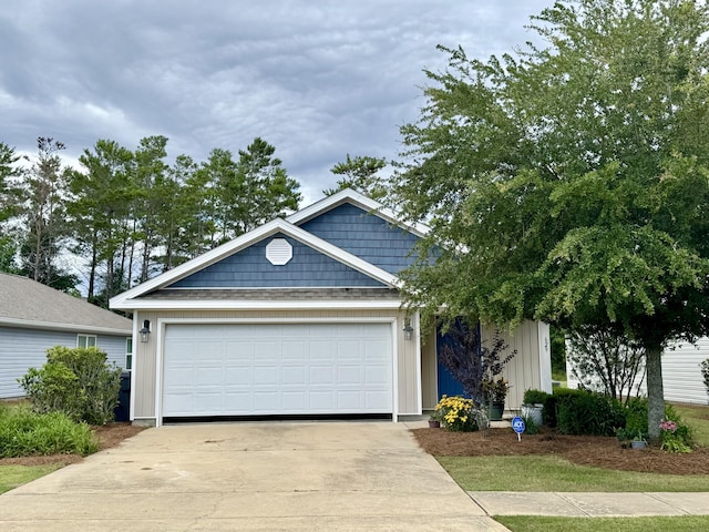 629 Earl Godwin Rd, Freeport, FL 32439 - view of front of house with driveway and an attached garage