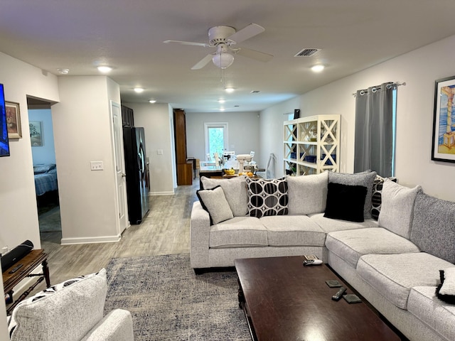 629 Earl Godwin Rd, Freeport, FL 32439 - living area with light wood finished floors and ceiling fan