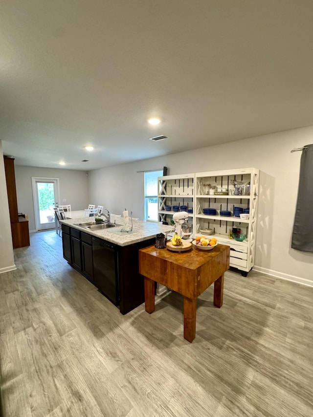 629 Earl Godwin Rd, Freeport, FL 32439 - kitchen with black dishwasher, light wood-style flooring, a center island, and recessed lighting