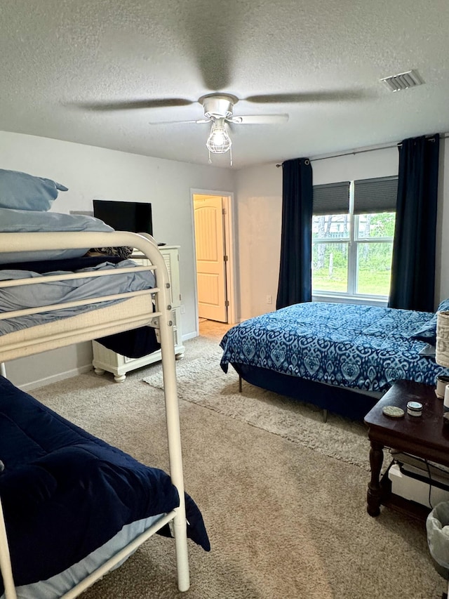 629 Earl Godwin Rd, Freeport, FL 32439 - carpeted bedroom with a textured ceiling and a ceiling fan
