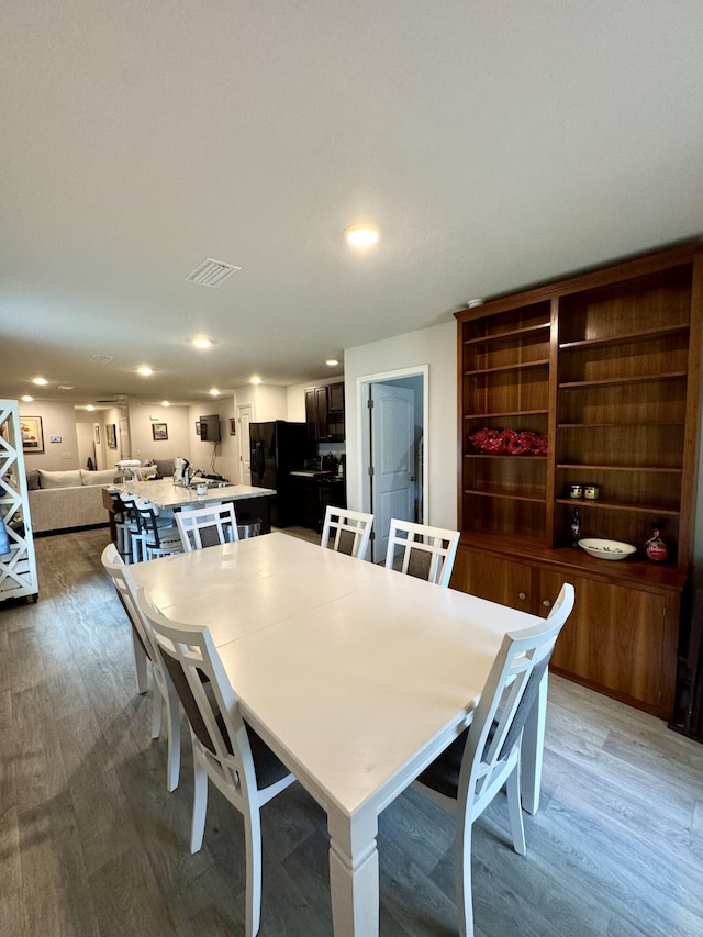 629 Earl Godwin Rd, Freeport, FL 32439 - dining area with light wood-style flooring and recessed lighting
