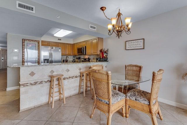 866 Santa Rosa Blvd Unit 302, Fort Walton Beach, FL 32548 - dining room with a chandelier and light tile patterned floors
