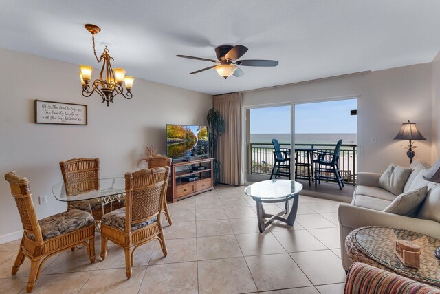 866 Santa Rosa Blvd Unit 302, Fort Walton Beach, FL 32548 - living room with a ceiling fan, a chandelier, and light tile patterned floors