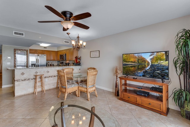 866 Santa Rosa Blvd Unit 302, Fort Walton Beach, FL 32548 - dining space with ceiling fan, a chandelier, and light tile patterned floors