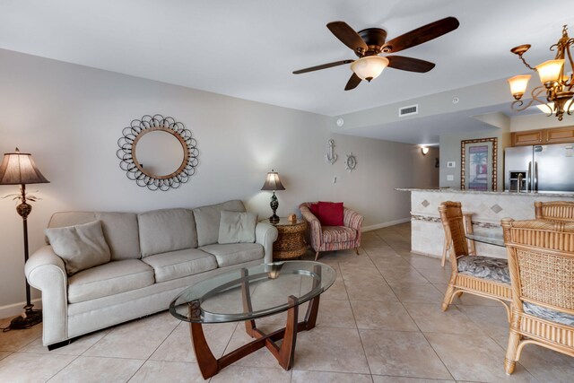 866 Santa Rosa Blvd Unit 302, Fort Walton Beach, FL 32548 - living room with light tile patterned floors, a ceiling fan, and a chandelier