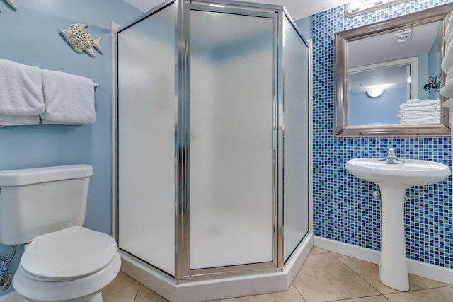 866 Santa Rosa Blvd Unit 302, Fort Walton Beach, FL 32548 - bathroom with tile patterned floors, a shower stall, and tile walls
