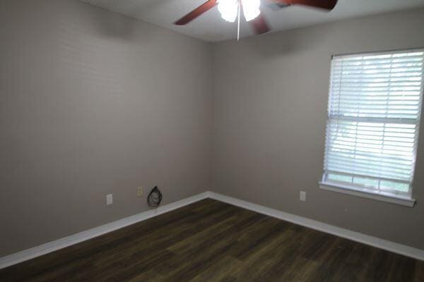 116 Nicole Ln, Crestview, FL 32539 - unfurnished room with ceiling fan and dark wood finished floors
