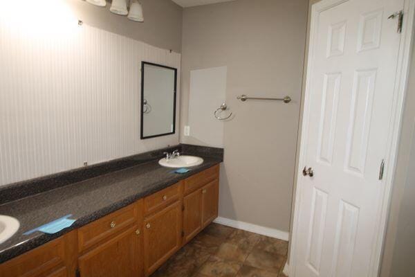 116 Nicole Ln, Crestview, FL 32539 - bathroom with double vanity and baseboards