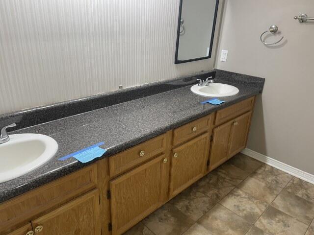 116 Nicole Ln, Crestview, FL 32539 - bathroom with double vanity and baseboards