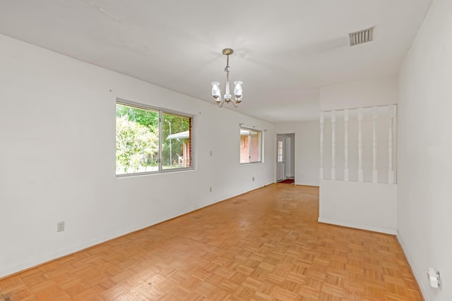 19 Bayview Dr, Shalimar, FL 32579 - unfurnished room featuring a chandelier and baseboards