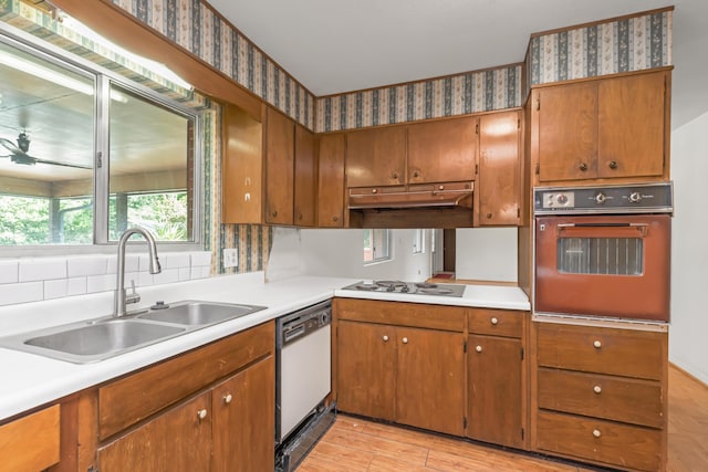 19 Bayview Dr, Shalimar, FL 32579 - kitchen featuring white appliances, light countertops, brown cabinets, and wallpapered walls