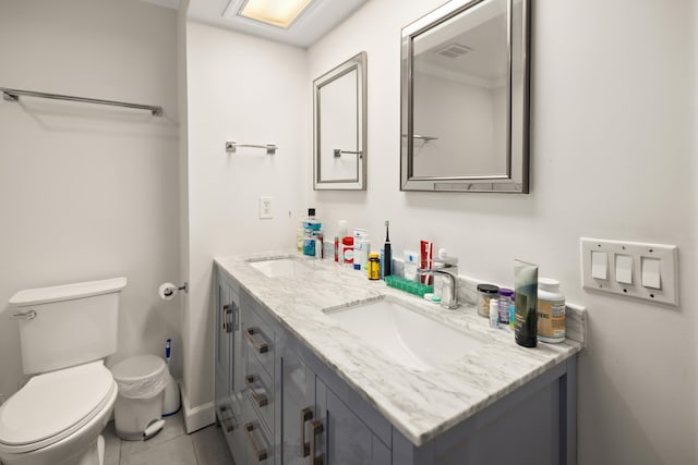 113 Durango Rd, Destin, FL 32541 - bathroom with double vanity, toilet, and tile patterned floors