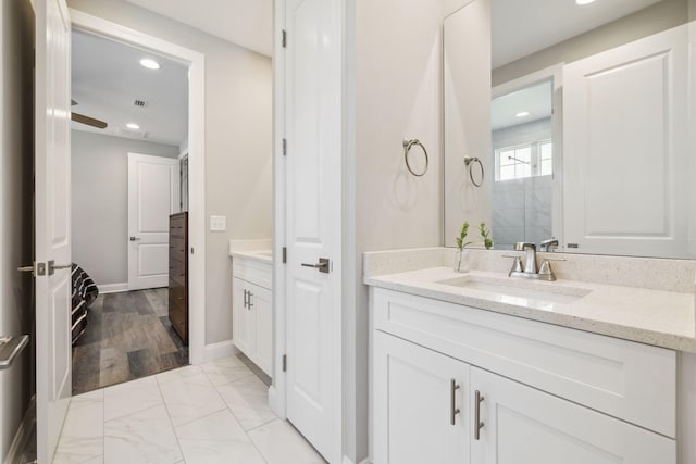 304 Windrow Way, Inlet Beach, FL 32461 - bathroom featuring vanity, recessed lighting, marble look tiles, and baseboards
