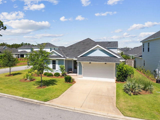 304 Windrow Way, Inlet Beach, FL 32461 - view of front of house featuring a shingled roof, an attached garage, and concrete driveway