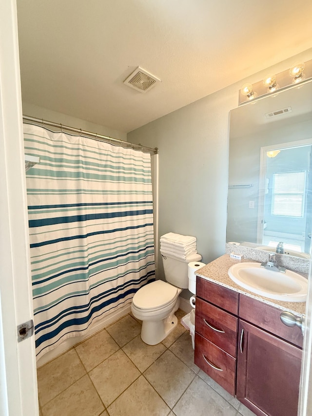 9902 S Thomas Dr Unit 1828, Panama City Beach, FL 32408 - full bathroom with vanity, toilet, tile patterned floors, and a shower with shower curtain