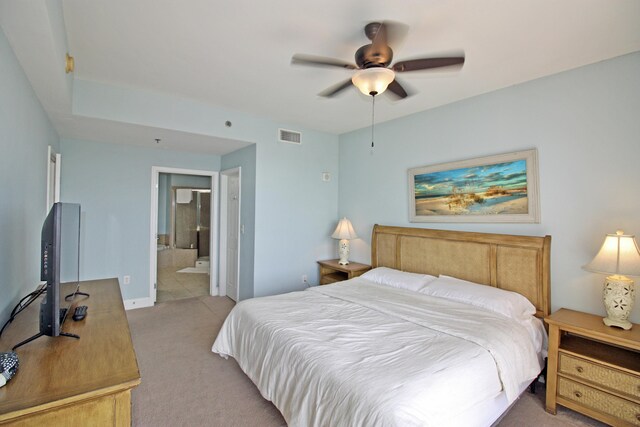 9902 S Thomas Dr Unit 1828, Panama City Beach, FL 32408 - bedroom with light colored carpet, connected bathroom, baseboards, and ceiling fan