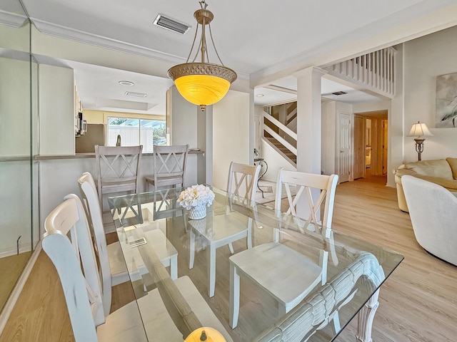 458 Linkside Pl, Miramar Beach, FL 32550 - dining area with light wood-type flooring and ornamental molding