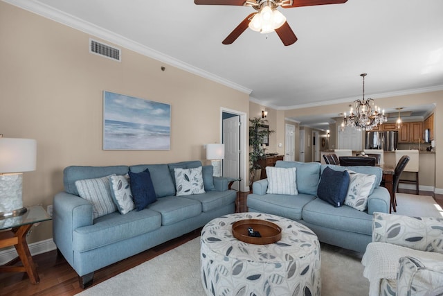 112 Seascape Dr Unit 1201, Miramar Beach, FL 32550 - living room featuring baseboards, crown molding, a chandelier, a ceiling fan, and light wood-style floors