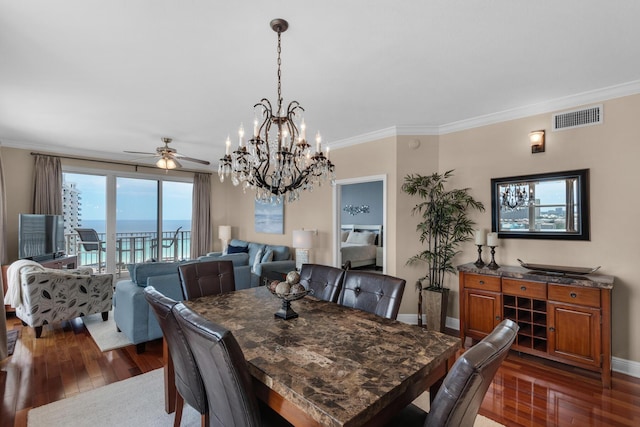 112 Seascape Dr Unit 1201, Miramar Beach, FL 32550 - dining room with dark wood-style floors, a chandelier, ornamental molding, ceiling fan, and baseboards