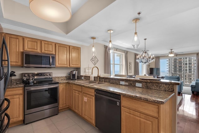 112 Seascape Dr Unit 1201, Miramar Beach, FL 32550 - kitchen with appliances with stainless steel finishes, a sink, a peninsula, open floor plan, and crown molding