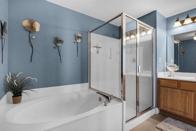 112 Seascape Dr Unit 1201, Miramar Beach, FL 32550 - bathroom featuring a garden tub, vanity, and a stall shower