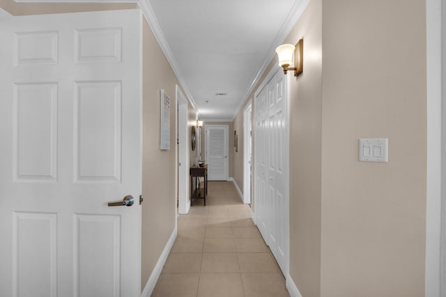 112 Seascape Dr Unit 1201, Miramar Beach, FL 32550 - corridor with baseboards, light tile patterned flooring, and crown molding