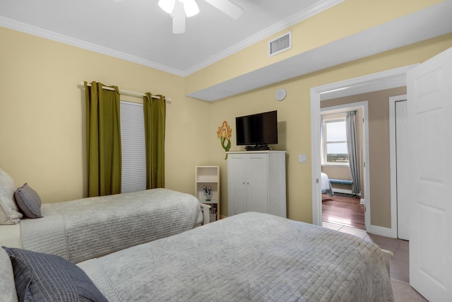 112 Seascape Dr Unit 1201, Miramar Beach, FL 32550 - bedroom with ornamental molding, tile patterned flooring, ceiling fan, and baseboards