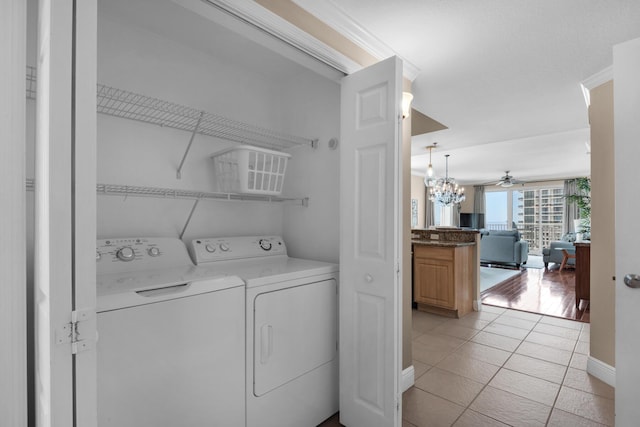 112 Seascape Dr Unit 1201, Miramar Beach, FL 32550 - laundry area with washing machine and clothes dryer, ceiling fan, baseboards, and light tile patterned floors