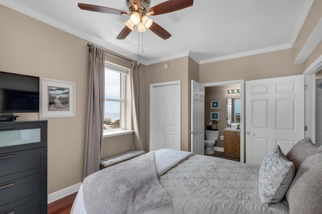 112 Seascape Dr Unit 1201, Miramar Beach, FL 32550 - bedroom with baseboards, ornamental molding, ensuite bathroom, a closet, and ceiling fan