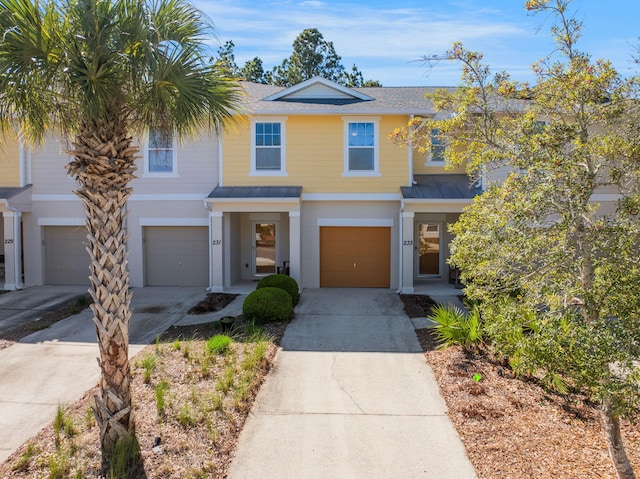 233 Sand Oak Blvd, Panama City Beach, FL 32413 - view of front of home with concrete driveway, a garage, stucco siding, and a shingled roof