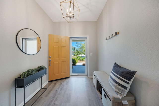 233 Sand Oak Blvd, Panama City Beach, FL 32413 - entryway with wood finished floors, a chandelier, and baseboards
