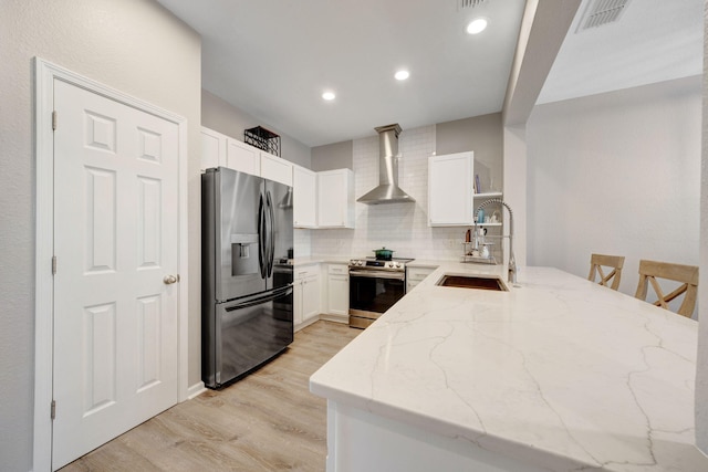 233 Sand Oak Blvd, Panama City Beach, FL 32413 - kitchen featuring fridge with ice dispenser, electric stove, wall chimney exhaust hood, a sink, and light stone countertops
