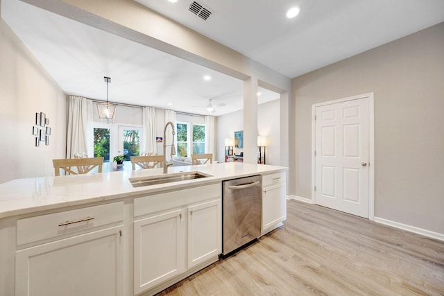 233 Sand Oak Blvd, Panama City Beach, FL 32413 - kitchen featuring dishwasher, a sink, light wood finished floors, baseboards, and white cabinetry