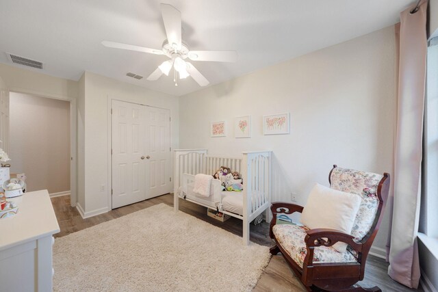 233 Sand Oak Blvd, Panama City Beach, FL 32413 - bedroom featuring wood finished floors, a closet, a ceiling fan, and baseboards