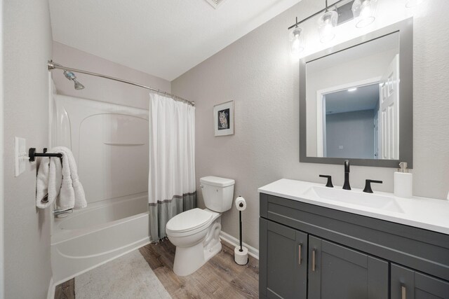 233 Sand Oak Blvd, Panama City Beach, FL 32413 - full bathroom featuring vanity, toilet, wood finished floors, shower / bath combo, and baseboards