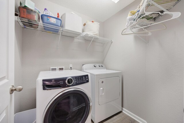 233 Sand Oak Blvd, Panama City Beach, FL 32413 - washroom featuring independent washer and dryer, wood finished floors, and baseboards
