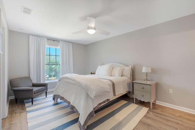 233 Sand Oak Blvd, Panama City Beach, FL 32413 - bedroom featuring baseboards, light wood-style floors, and a ceiling fan